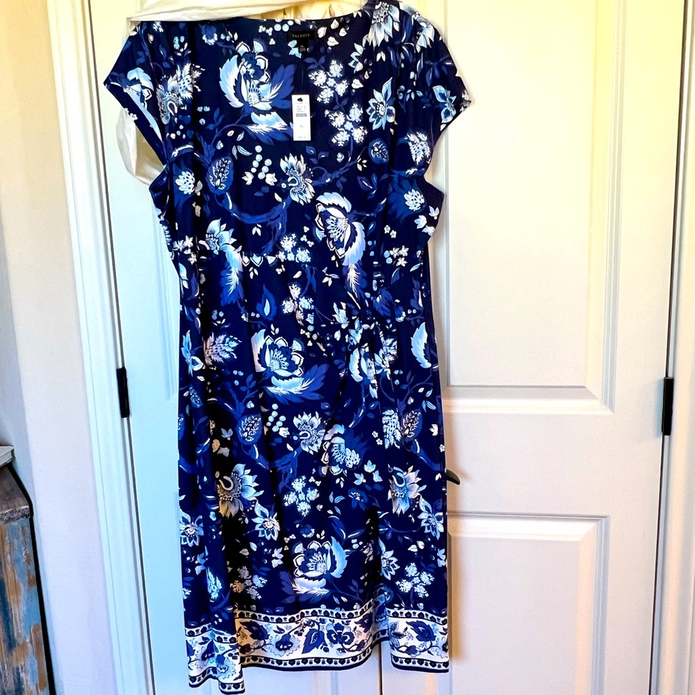 Brand new spring dress in beautiful blues. Never worn. Very comfortable, midi